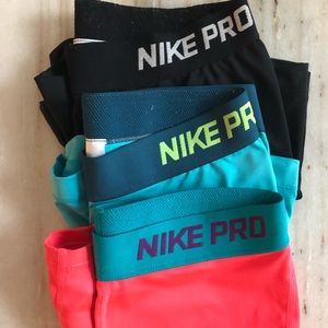 3 pairs of Nike Slides